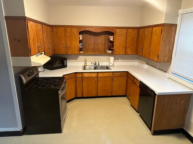 Kitchen - all appliances included: stove/oven, microwave , dishwasher. More appliances available. - 203 Pleasant St