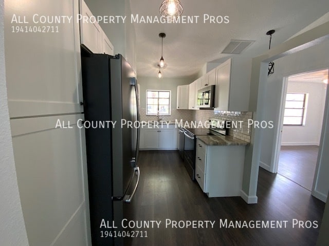 Building Photo - Villa Style Condo With Dual Master Suites,...