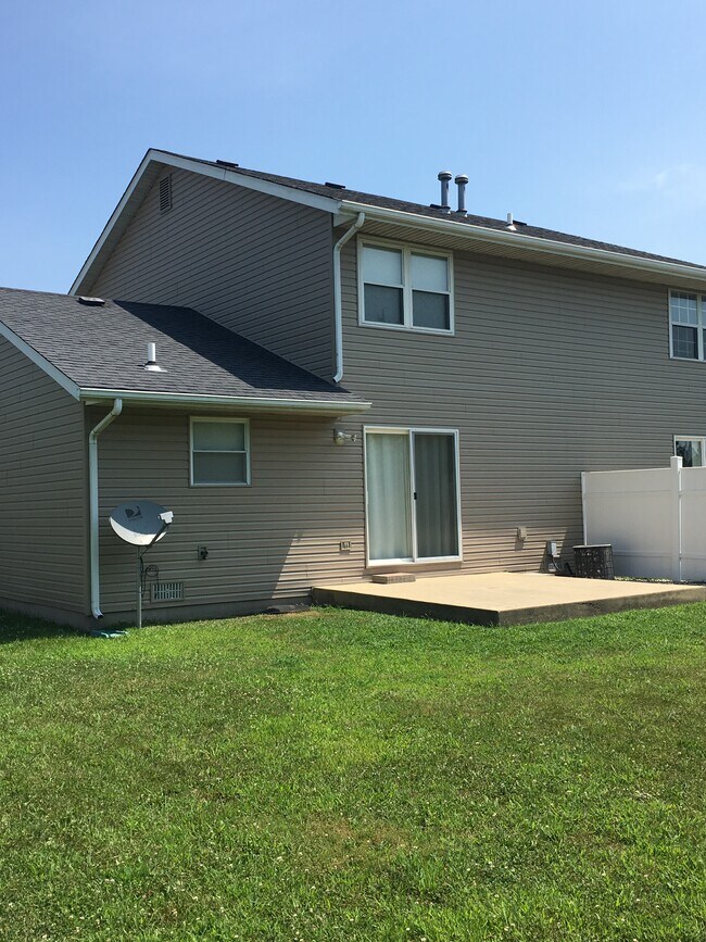 Back of duplex, patio, and big backyard - 1401 Chancellor Dr