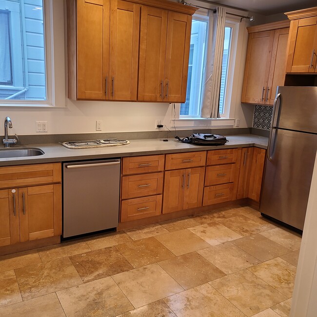 Kitchen w/ stainless steel appliances - 440 34th Ave