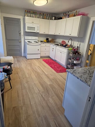 new kitchen towards back door - 208 N Normal St