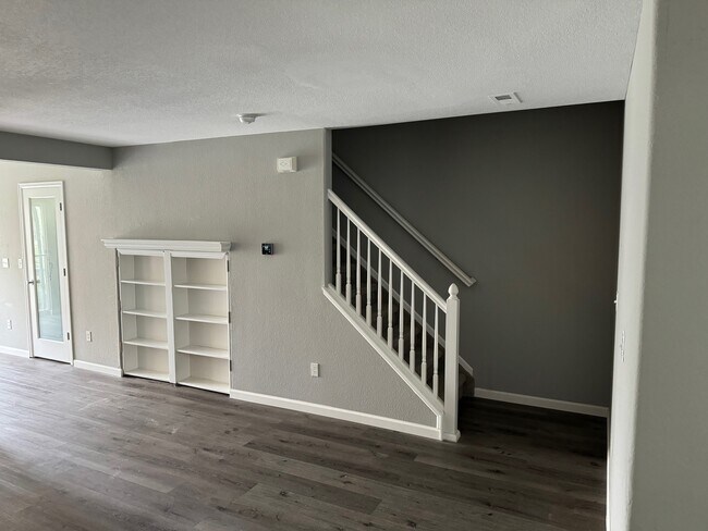 Built in Bookshelf with access to crawl space for storage - 7752 S. Kittredge Ct