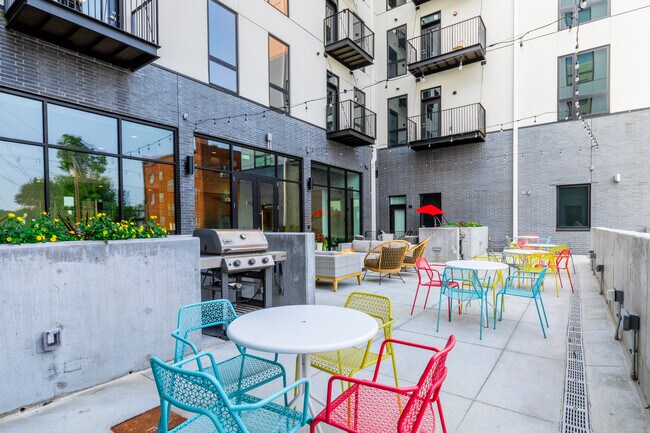 Salón al aire libre con parrillas - Corner Apartments