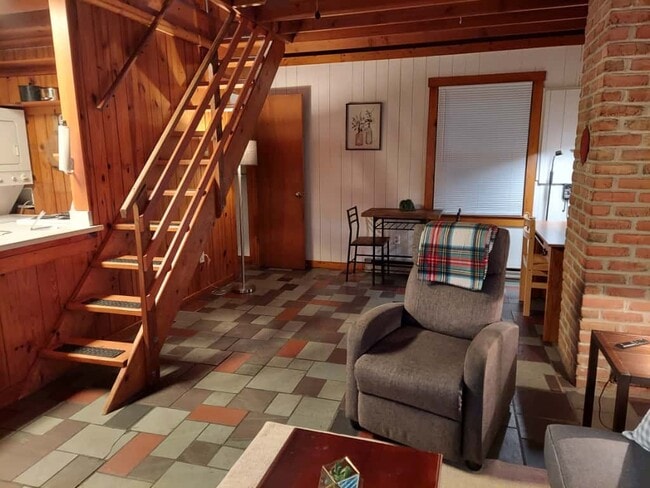 Stairs lead up to bedroom. Bathroom on main floor, behind stairs - 311 Newton Aly