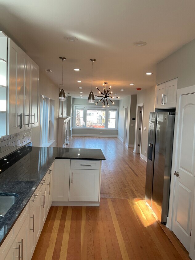 Kitchen, dining room and living room - 4037 W Roscoe St