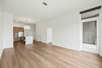 The living room and kitchen of The Fans III - One Rangers Way