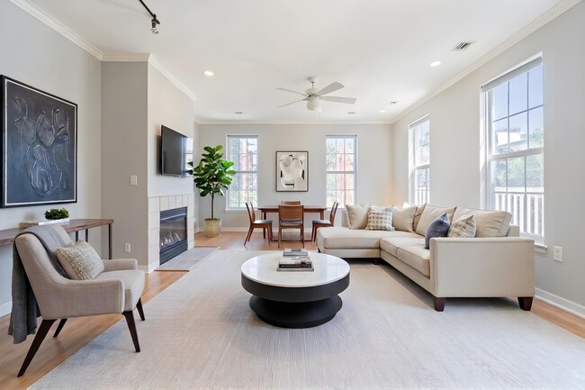 A living area with fireplace at The Residences at King Farm - The Residences at King Farm