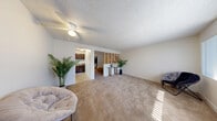 Located at 655 Sierra Vista Dr in Las Vegas, NV, this one-bedroom, one-bathroom unit offers a practical and efficiently designed layout across a single floor. The open-concept living area is the heart of the space, where the living room, dining area, and kitchen flow together seamlessly. Warm-toned carpet covers the living and bedroom areas, while large windows allow natural light to fill the space, creating a bright and airy atmosphere. A ceiling fan with light fixture adds both comfort and functionality to the main living area.

A distinctive built-in shelving unit serves as a partial divider between the living room and the bedroom, adding a decorative architectural element while maintaining an open feel. The bedroom is a comfortable size, featuring a closet for storage.

The kitchen is efficiently arranged with dark wood cabinetry, a countertop with an integrated sink, and tile flooring. It includes a full-size refrigerator and range, providing all essential appliances in a compact footprint.

The bathroom features tile flooring, a dark wood vanity with a granite-style countertop, and a full tub and shower combination. Clean, neutral finishes throughout the unit create a cohesive and move-in-ready aesthetic.