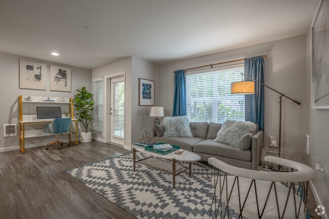 1BR, 1Ba - Sala de estar 659SF - Arya at Hedges Creek