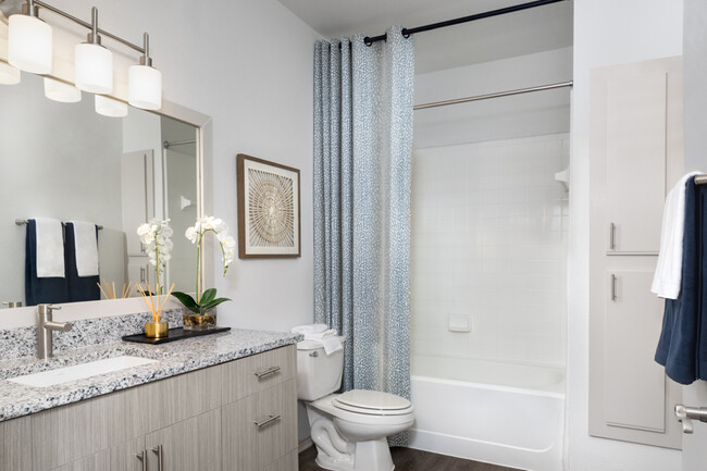 Wood grain cabinets and framed mirrors - The Ranch Apartments