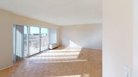 Located at 120 Prospect Ave in Hackensack, NJ, this single-floor residence offers a well-organized layout with a clean, neutral aesthetic throughout. The spacious living and dining area is a standout feature, showcasing classic parquet hardwood flooring in a distinctive geometric pattern that runs throughout much of the home. Large windows invite abundant natural light, casting warm patterns across the floors and creating an airy, open atmosphere. An elegant chandelier accents the dining area, adding a refined touch to the open-concept space.

The galley-style kitchen is efficiently designed, featuring white cabinetry, dark countertops, a stainless steel sink, and tile flooring, with direct access to the entry foyer. The entryway includes a built-in closet with shelving, offering practical storage from the moment you arrive.

A hallway lined with mirrored closet doors connects the main living areas to the private quarters, enhancing the sense of space. The unit includes two full bathrooms, both finished with warm stone-toned tile. One bathroom features a tub-shower combination with marble-style tile surround, while the second offers a glass-enclosed shower and a vanity with a large wall mirror and globe lighting. Both bathrooms are clean and functional in design.