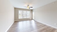 Located at 150 Fieldstone Lane in Daleville, Virginia, this 2-bedroom, 2-bathroom residence offers a functional and comfortable single-floor layout. The open-concept living area features warm wood-look luxury vinyl plank flooring and a ceiling fan, with large windows that invite an abundance of natural light and views of the surrounding neighborhood. The adjacent kitchen is well-equipped with rich warm-toned wood cabinetry, white quartz countertops, stainless steel appliances including a refrigerator, range, over-the-range microwave, and dishwasher, as well as pendant lighting over the countertop bar area. The primary bedroom is generously sized with soft carpeting, a ceiling fan, and two dedicated closets offering ample storage. The second bedroom also features plush carpeting, a ceiling fan, and a large window that brightens the room. Both bathrooms are finished with clean, white tub-shower combinations, tile flooring, and neutral wall tones that create a crisp, functional atmosphere. A neutral color palette throughout the home provides a versatile backdrop for any interior style. Two closets further enhance storage capacity, making this a highly practical and comfortable residence.