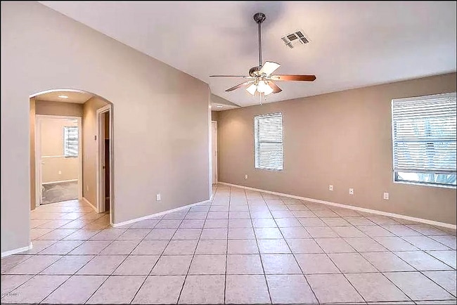 Large family room with tile floor - 10608 E Caballero St