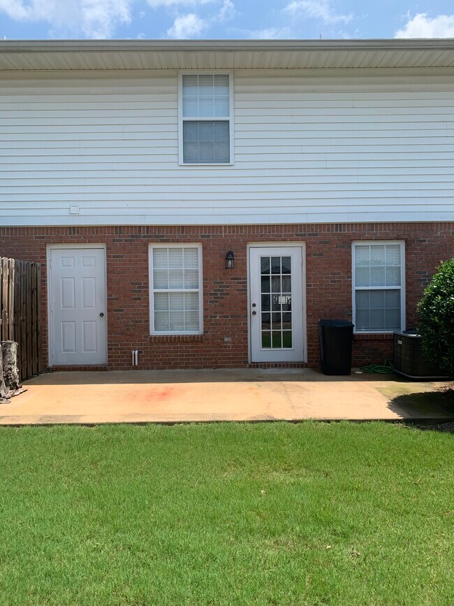Rear patio with outside storage unit - 1477 N Donahue Dr