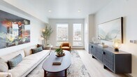 Located at 1201 W Grove St in the heart of Boise, Idaho, this thoughtfully designed one-bedroom, one-bathroom residence offers a modern urban living experience on a single floor. The open-concept layout seamlessly connects the kitchen, dining, and living areas, creating an efficient and inviting space filled with natural light.

The kitchen is a standout feature, boasting rich walnut-toned cabinetry extending to the ceiling, a striking white geometric tile backsplash, dark quartz countertops, a full suite of stainless steel appliances, and a large center island with bar seating — ideal for both cooking and casual dining.

The combined living and dining area benefits from large windows that frame panoramic views of the Boise cityscape and surrounding mountains, flooding the space with natural light. Light-toned hardwood flooring flows throughout, enhancing the bright, contemporary aesthetic.

The bedroom is a serene retreat, featuring oversized windows with additional city views and ample closet space. The bathroom offers a clean, minimalist design with tile surround tub/shower and wood-toned vanity cabinetry. Additional conveniences include an in-unit laundry area and two closets, making this a fully functional and stylish urban residence.