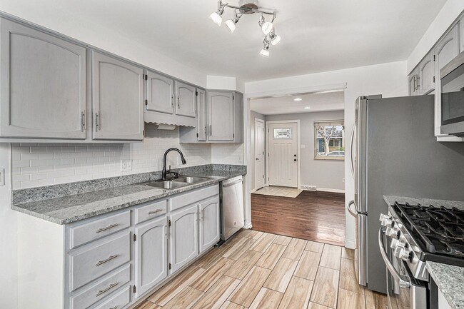 Building Photo - Updated Five-Bedroom Brick Ranch in the He...