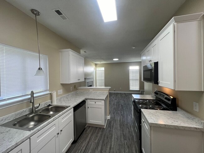 Building Photo - Welcome to Timbertop5127, a well-appointed 4-bedroom, 2.5-bath home in Charlotte, NC.