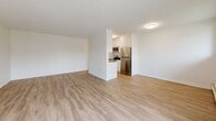 Located at 543 Mornington Ave in London, Ontario, this well-appointed 2-bedroom, 1-bathroom unit offers a comfortable and functional layout across a single floor. The open-concept living area flows seamlessly into a kitchen equipped with white cabinetry, dark countertops, and stainless steel appliances including a refrigerator, microwave, and stove. Light wood laminate flooring runs throughout the unit, lending a clean and contemporary feel to every room. The spacious living room features a sliding glass door that opens onto a private balcony, offering views of the surrounding greenery, manicured lawns, and the broader neighbourhood. Both bedrooms are bright and well-sized, with large windows that admit natural light and baseboard heating for year-round comfort. The primary bedroom is generously proportioned, providing ample space for a full bedroom suite. The full bathroom is finished with classic white subway tile surrounding a soaker tub and shower combination, complemented by clean white fixtures. A hallway connects the main living spaces to the bedrooms and bathroom, contributing to an efficient and practical floor plan. The unit's neutral colour palette and modern finishes create a bright, move-in-ready living environment.