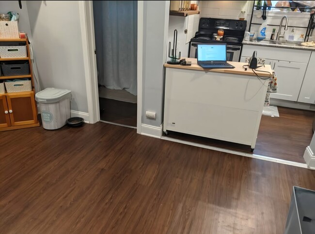 Standing in dining room facing kitchen. One bedroom to right, bathroom ahead, living room to left. - 106 Atkinson St