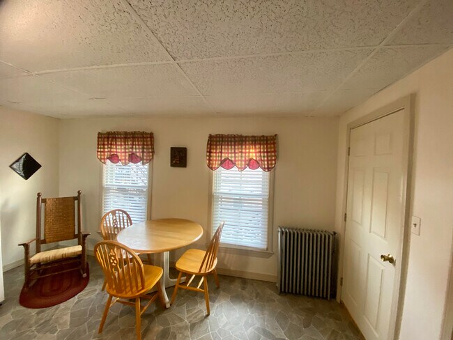 Kitchen and entrance door to apartment, area could become sitting area in the event the living room converted to bedroom. - 154 College St