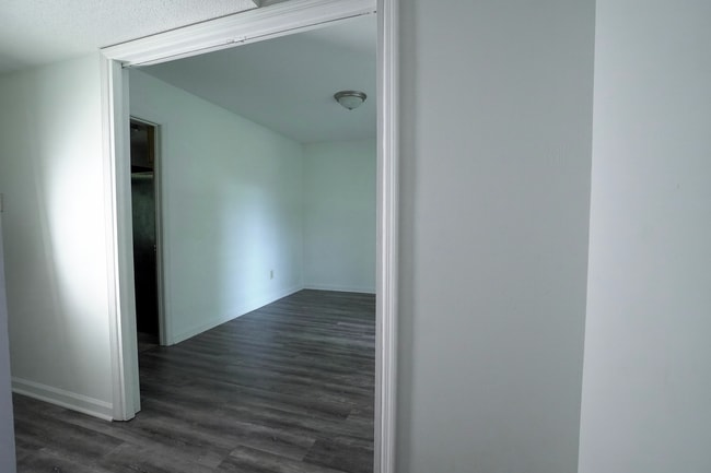 Spacious dining area with natural light and updated laminate flooring. - 2313 Salem West Dr