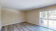 Located at 7799 Farmgate Way in Citrus Heights, California, this single-floor residence offers a practical and well-organized layout with two bedrooms and two full bathrooms. The kitchen is equipped with warm oak cabinetry, granite-style countertops, and white appliances including a range, over-the-range microwave, and refrigerator, all set atop light wood-look vinyl flooring that carries through the hallway and bathrooms. The space flows through a connecting hallway that links the main living areas to the bedrooms.

Both bedrooms feature neutral beige carpet, warm-toned walls, and windows that bring in natural light with views of the surrounding neighborhood. The primary bedroom includes a built-in closet with paneled bifold doors, providing ample storage. The second bedroom is cozy and similarly styled with soft carpeting and bright walls.

The two bathrooms are finished with the same wood-look flooring and oak vanities with stone-style countertops. One bathroom features a full shower-tub combination, while the other offers a dedicated walk-in shower stall, providing convenient options for residents. Clean white walls and chrome fixtures give both bathrooms a fresh, functional feel. Overall, the space presents a clean, move-in-ready interior with consistent finishes throughout.