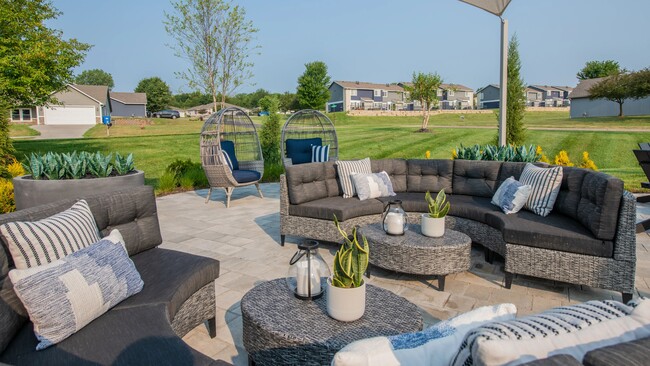 Experience leisure and unwind in our open-air Cloud Lounge, offering Wi-Fi, a serene fire pit, and plush seating. - Emory Lakes Luxury Apartments