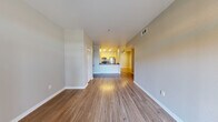 Located at 3025 W Christoffersen Pkwy in Turlock, CA, this well-designed one-bedroom, one-bathroom residence offers a thoughtful single-floor layout that maximizes functionality and comfort. The open-concept great room serves as the heart of the home, featuring warm wood-style flooring, neutral-toned walls, and a sliding glass door that fills the living area with natural light and provides access to an outdoor balcony with green views.

The kitchen is defined by a peninsula counter with dark, reflective countertops that contrast elegantly with light wood cabinetry. Stainless steel appliances — including a refrigerator, range, and microwave — complete the modern aesthetic. Recessed lighting overhead adds a bright, clean ambiance to the cooking space, which also features a convenient built-in desk or counter nook.

The spacious bedroom offers plush carpeting for comfort underfoot, neutral walls, and a dedicated closet for storage. The full bathroom includes a tub-shower combination, wood-style flooring, and a vanity with dark countertops that coordinate with the kitchen's finish palette.

Clean lines, a cohesive neutral color scheme, and thoughtful layout make this residence a practical and inviting space in the heart of Turlock.