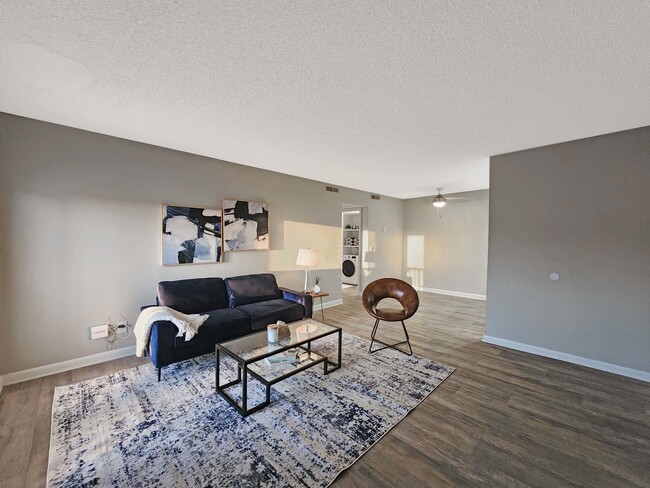 Living Room with Hardwood-Style Flooring - Amalie Apartment Homes