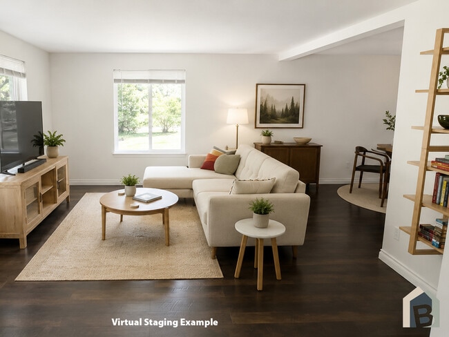 Bright welcoming living room with a view of lawn and mature evergreens - 20981 Port Gamble Rd NE