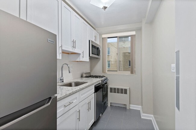 Renovated Kitchen with granite countertops and stainless steel appliances - Idaho Terrace