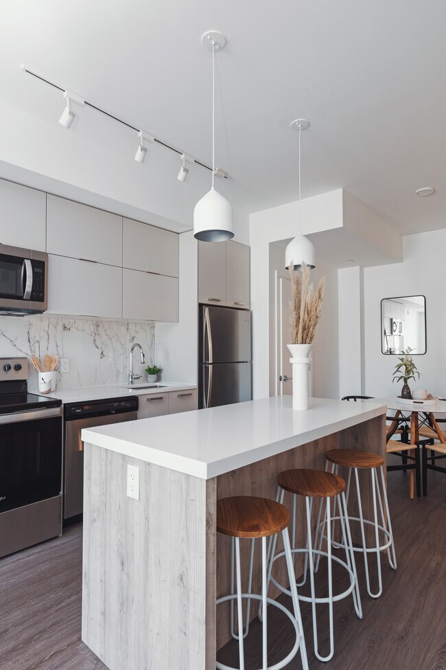 Photo du bâtiment - Brand New 1 Bed + Den Unit in Boutique Building on Stittsville Main