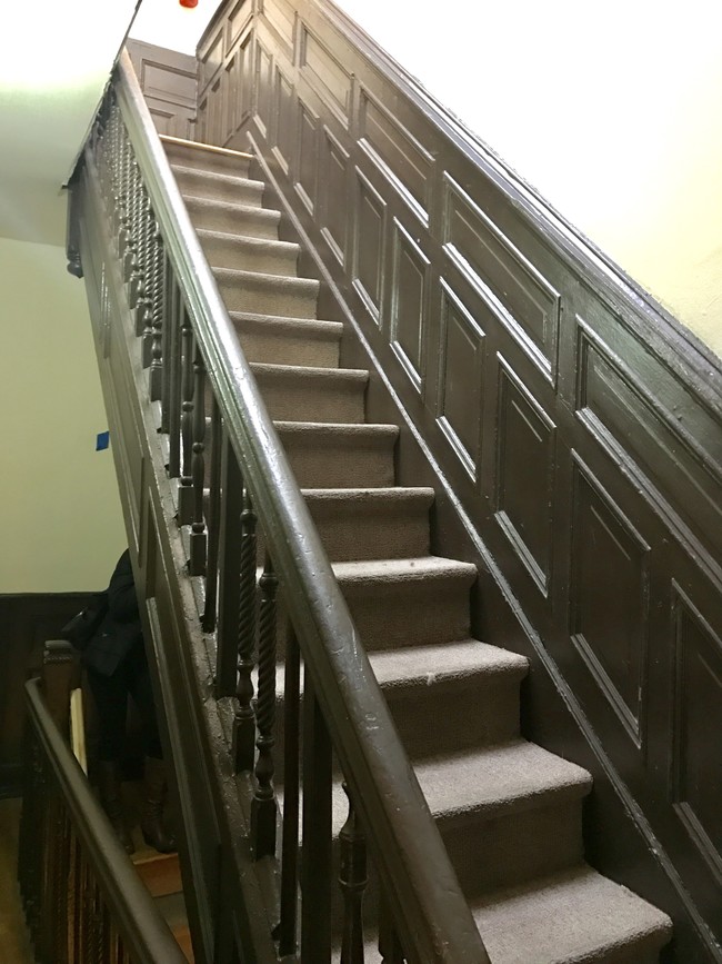 Hallway Railings can be restored to original wood finish - 262 Vernon Ave