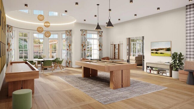 Sala de juegos con billar, tejo, mesa de póquer y asientos cómodos en Modera South Shore en Marshfield, MA. - Modera South Shore