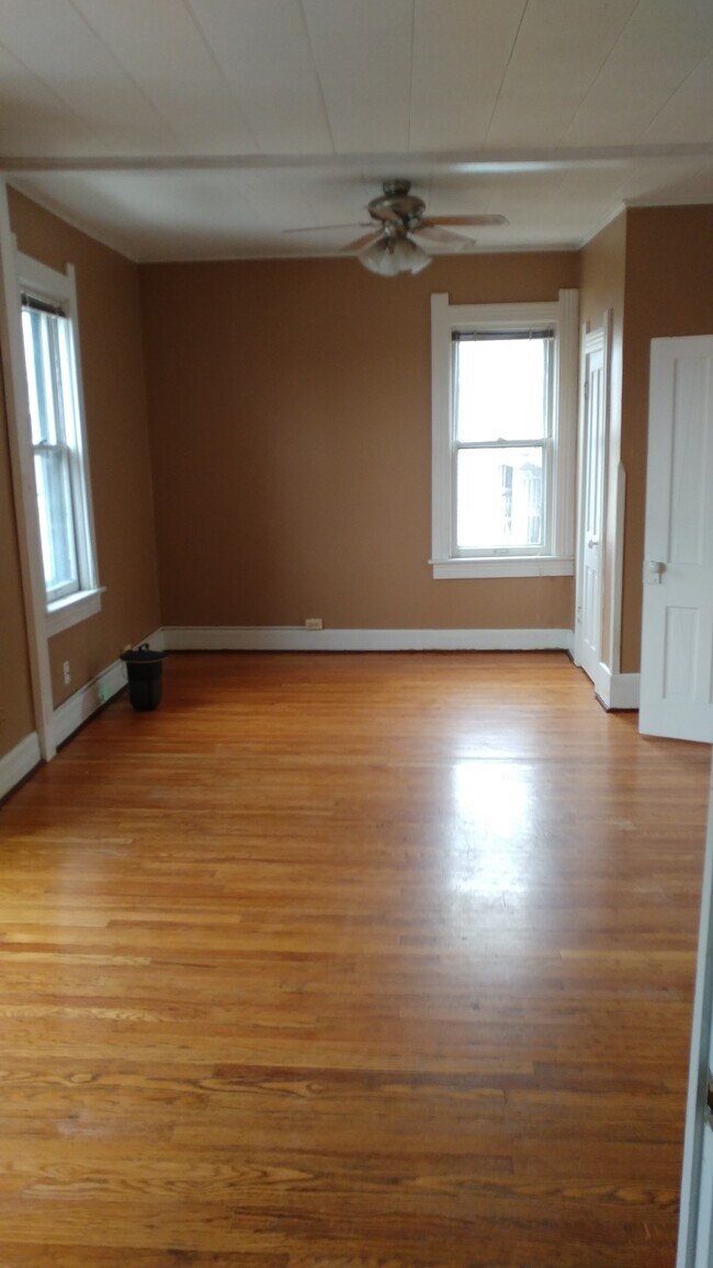 living room partial view wood floors - 228 E Jackson St