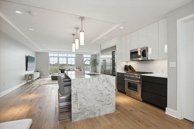 Photo - Elegant 2BR at The Adora | 1,500+ SF, Chef’s Kitchen & Garage Parking! House