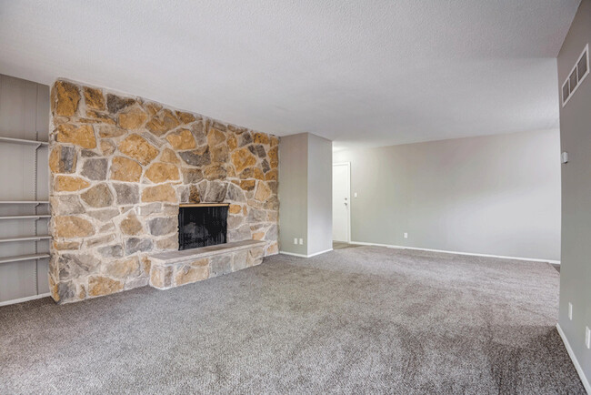 Fireplace with stone accent wall. - Corinth Valley