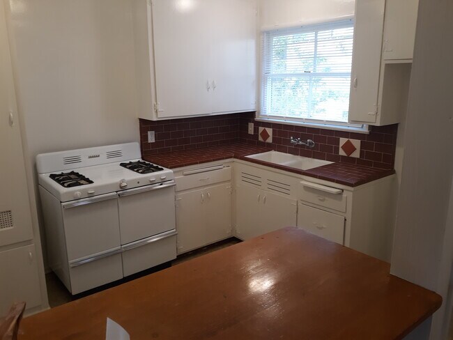 kitchen with red tile counter tops - 13309 Valleyheart Dr N