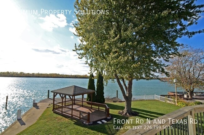 Building Photo - ALL INCLUSIVE! Stunning Waterfront Home