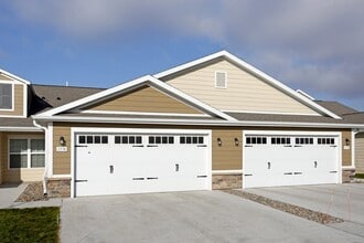 Charming Neighborhood Setting with Two-Car Garages - Redwood Ankeny