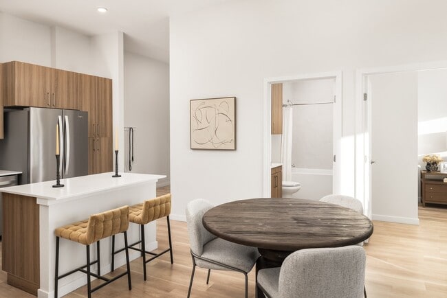 Quartz countertops with designer tile backsplashes at The Madison. - The Madison and The Fillmore at Copperleaf