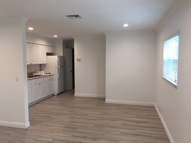Dining and Kitchen area. End of room leads to bathroom and bedroom. - 514 SW 11th CT