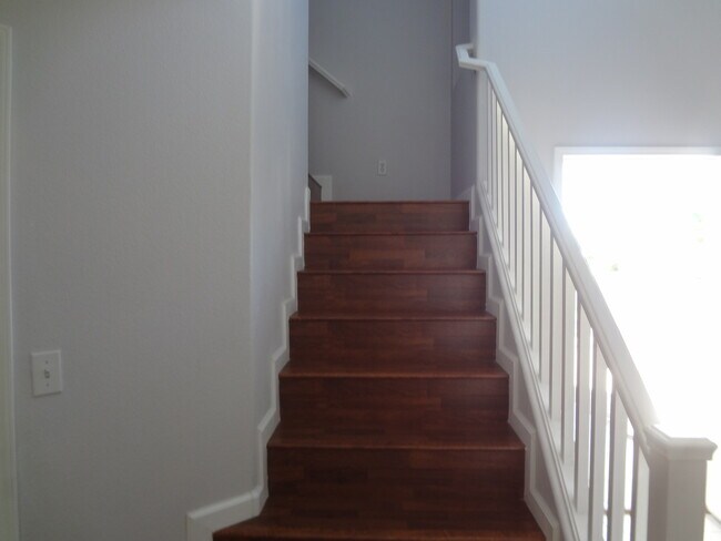 Building Photo - THIS 1,596 SQ. FT. HOME HAS 3 BEDROOMS, 2.5 BATHROOMS, A 2 CAR GARAGE LOCATED ON A CORNER LOT AND...