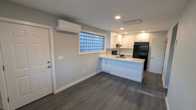 Living into kitchen - 2378 E 15th Ave