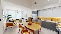 Located at 2214 N Miami Ave in Miami's dynamic Wynwood neighborhood, this well-appointed one-bedroom, one-bathroom residence offers a thoughtfully designed open-concept layout on a single floor. Light-toned large-format tile flooring flows throughout the main living areas, reinforcing the home's clean, contemporary aesthetic.

The open living and dining area is bright and airy, with floor-to-ceiling windows dressed in sheer white curtains that flood the space with natural light and offer city views. A modern globe chandelier serves as a focal point above the dining area, which comfortably accommodates a natural wood oval dining table. The living room features generous wall space for art and ample room for comfortable seating arrangements.

The kitchen is outfitted with two-tone cabinetry — matte white upper cabinets and slate-grey lower cabinets — complemented by warm under-cabinet lighting, a tile backsplash, white quartz countertops, and a full suite of stainless steel appliances including a French door refrigerator.

The primary bedroom features warm wood flooring, generous closet space, large windows with city views, and high ceilings that enhance the sense of spaciousness. The bathroom is finished with a frameless glass walk-in shower clad in wood-look tile, a floating white vanity, and an illuminated mirror, delivering a sleek, spa-like experience.