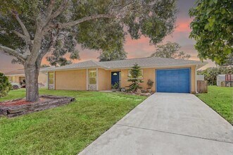 Building Photo - 1612 SE Cascella Ct