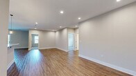 Located at 1125 Old Graves Mill Rd in Lynchburg, Virginia, this single-story, three-bedroom, one-bathroom home offers a well-designed layout across a comfortable and functional floor plan. The open-concept living, dining, and kitchen area forms the heart of the home, featuring warm hardwood-style flooring, recessed lighting, and a clean, neutral color palette that creates a bright and welcoming atmosphere throughout.

The kitchen is a standout feature, equipped with rich dark cabinetry, granite countertops, a central island with pendant lighting, and a full suite of stainless steel appliances including a refrigerator, range, microwave, and dishwasher. An adjoining pantry and in-unit laundry area add everyday convenience.

All three bedrooms are carpeted and include ceiling fans, providing a cozy and comfortable retreat. The spacious primary bedroom offers generous proportions with ample closet space. Throughout the home, five closets ensure excellent storage capacity.

The bathroom is well-appointed with a walk-in shower, dark wood vanity, white countertop, and neutral stone-look tile flooring. The overall design of this home emphasizes clean finishes, practical layout, and move-in-ready condition, making it an attractive and functional residence in the Lynchburg area.