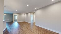 Located at 1125 Old Graves Mill Rd in Lynchburg, Virginia, this single-story, three-bedroom, one-bathroom home offers a well-designed layout across a comfortable and functional floor plan. The open-concept living, dining, and kitchen area forms the heart of the home, featuring warm hardwood-style flooring, recessed lighting, and a clean, neutral color palette that creates a bright and welcoming atmosphere throughout.

The kitchen is a standout feature, equipped with rich dark cabinetry, granite countertops, a central island with pendant lighting, and a full suite of stainless steel appliances including a refrigerator, range, microwave, and dishwasher. An adjoining pantry and in-unit laundry area add everyday convenience.

All three bedrooms are carpeted and include ceiling fans, providing a cozy and comfortable retreat. The spacious primary bedroom offers generous proportions with ample closet space. Throughout the home, five closets ensure excellent storage capacity.

The bathroom is well-appointed with a walk-in shower, dark wood vanity, white countertop, and neutral stone-look tile flooring. The overall design of this home emphasizes clean finishes, practical layout, and move-in-ready condition, making it an attractive and functional residence in the Lynchburg area.