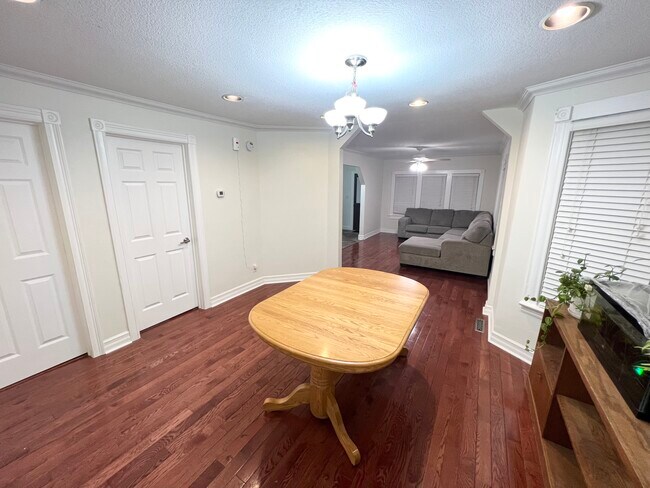 Dining Area/Living Room and doors to 1st floor bathroom and office room - 3947 DuPont Ave N