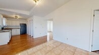 Located at 10770 US Highway 19 N in Pinellas Park, Florida, this single-floor, 2-bedroom, 2-bathroom home offers a practical and well-organized layout. The open-concept living, dining, and kitchen area forms the heart of the home, with warm hardwood-style flooring and light tile creating a cohesive, welcoming atmosphere. The kitchen is well-appointed with white shaker-style cabinetry, granite-look countertops, a double-basin sink, a dishwasher, a gas range, and a full-size refrigerator, along with a dedicated pantry for additional storage. Natural light filters through the windows, enhancing the bright, airy feel of the space. Both bedrooms feature hardwood-style flooring, ceiling fans, and windows that offer views of the surrounding greenery. The primary bedroom provides a comfortable footprint along with generous closet access. A hallway connects the bedrooms to two full bathrooms, each featuring a tub-shower combination with clean white tile surrounds. Additional highlights include five closets for ample storage, a utility room, and a patio for outdoor enjoyment. The efficient single-level floor plan makes for easy navigation throughout the home.
